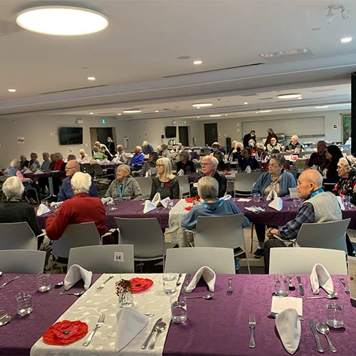 Residents taking in the Remembrance Day meal at Wisteria Place.