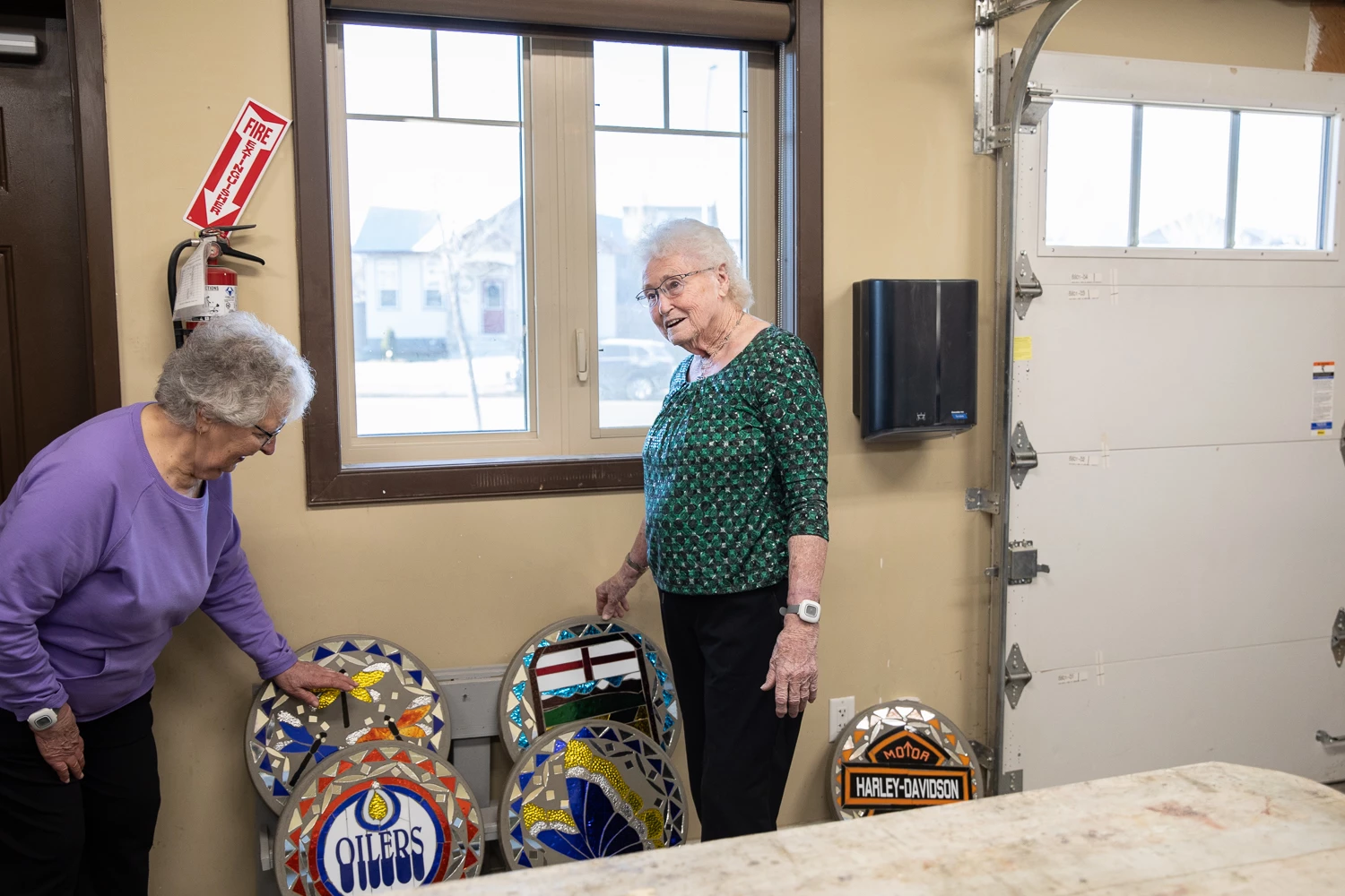 Nel and her friend showing of crafts