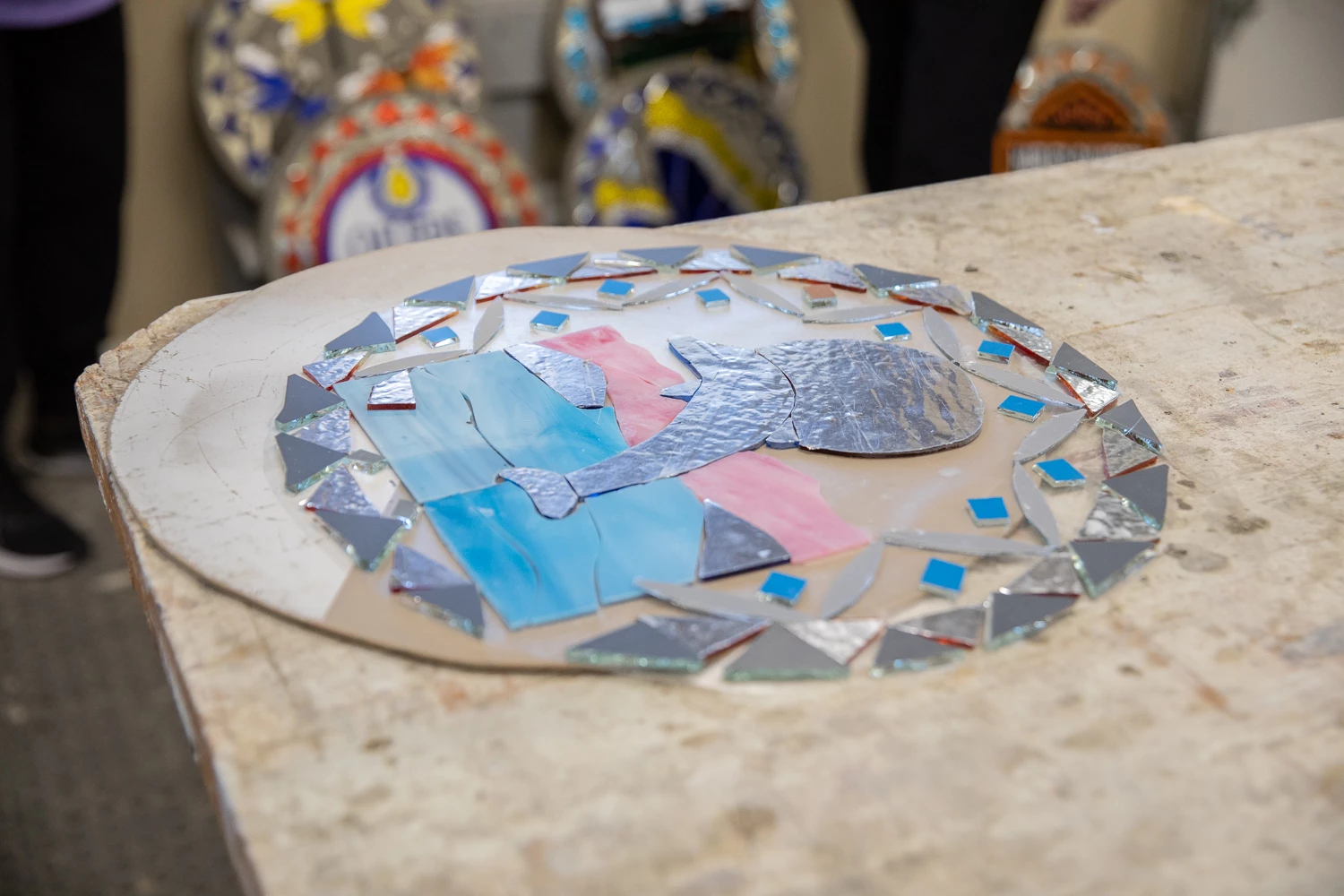 Stain glass pieces on a table