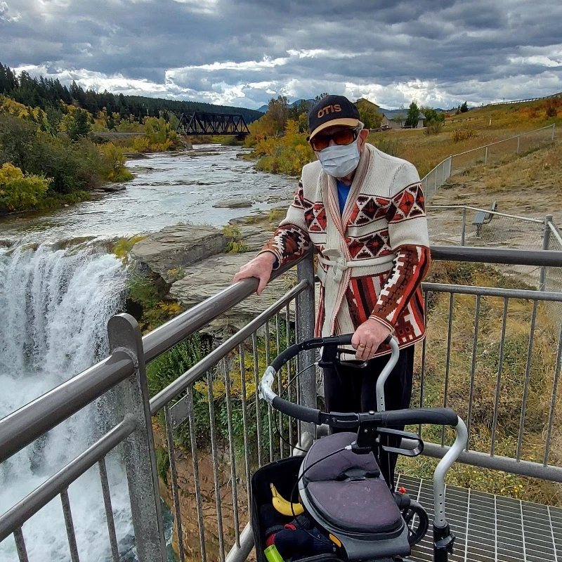 A elderly man watching scenic views
